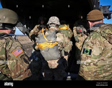 Members of the 1st Special Forces Group (Airborne) conduct an Airborne ...