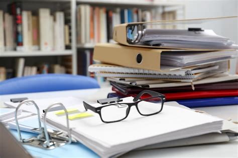 Premium Photo Documents And Glasses On Table In Archive