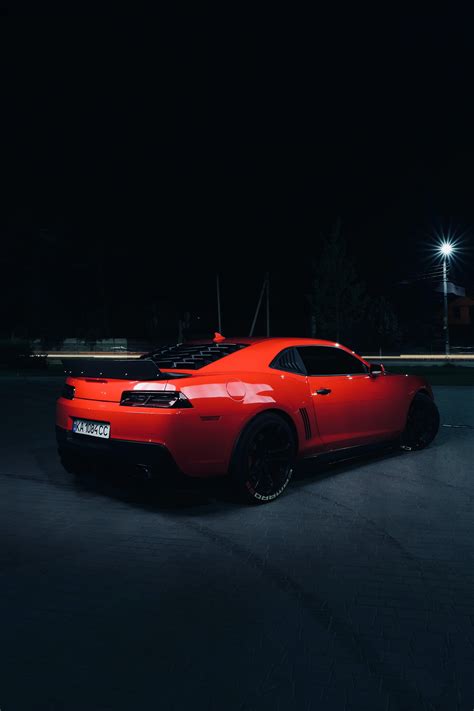 Red Chevrolet Camaro, sports car Wallpaper 3600x5400