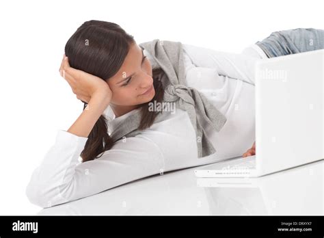 Teenager lying down with laptop Stock Photo - Alamy