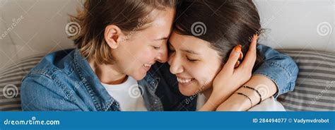 A Portrait Of The Happy Lesbian Couple Hugging On The Bed Stock Image Image Of Cropped