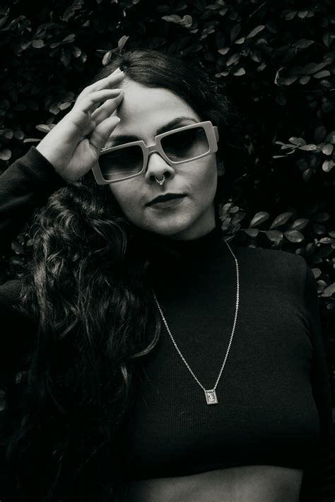 Black And White Photo Of An Attractive Young Woman In A Bra And Jacket