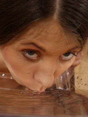 Charming Brunette Tresses Dives Into A Puddle Associated With The Dame