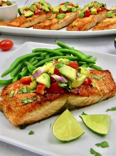 Fresh Seared Salmon Served With A Colorful And Tasty Avocado Salsa Over