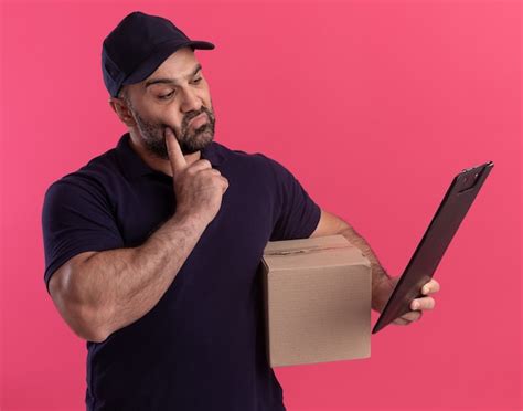 Free Photo Impressed Middle Aged Delivery Man In Uniform And Cap