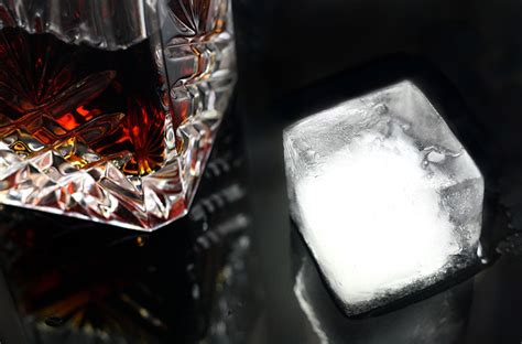 Experience the Art of Sipping: Elevate Your Bourbon with a Large Ice Cube Maker