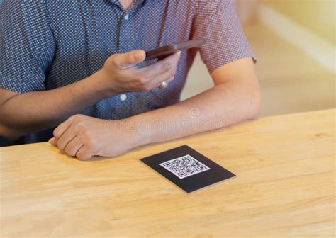 a man asking for payment in qr code, Qr code payment man stand near stock vector (royalty free) 1853806090