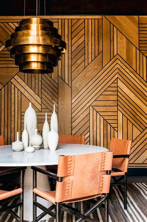 art deco feature wall, A living room filled with furniture and walls covered in leafy