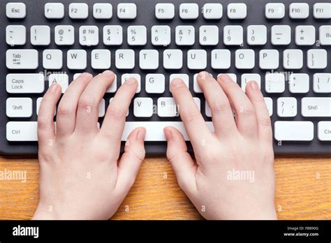 computer keyboard typing with hand pic, Top view of hands typing on computer keyboard stock photo