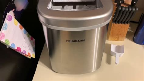 how to open frigidaire ice maker