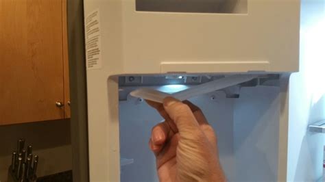 ice maker arm stuck in down position