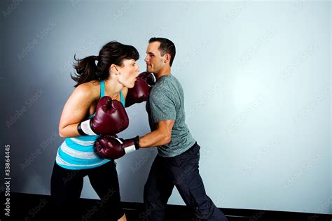 man punching a woman