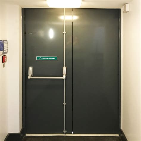 roller shutter emergency exit sign, Warning ensure roller door is fully up before proceeding sign