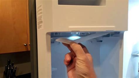 whirlpool refrigerator ice maker arm stuck in up position